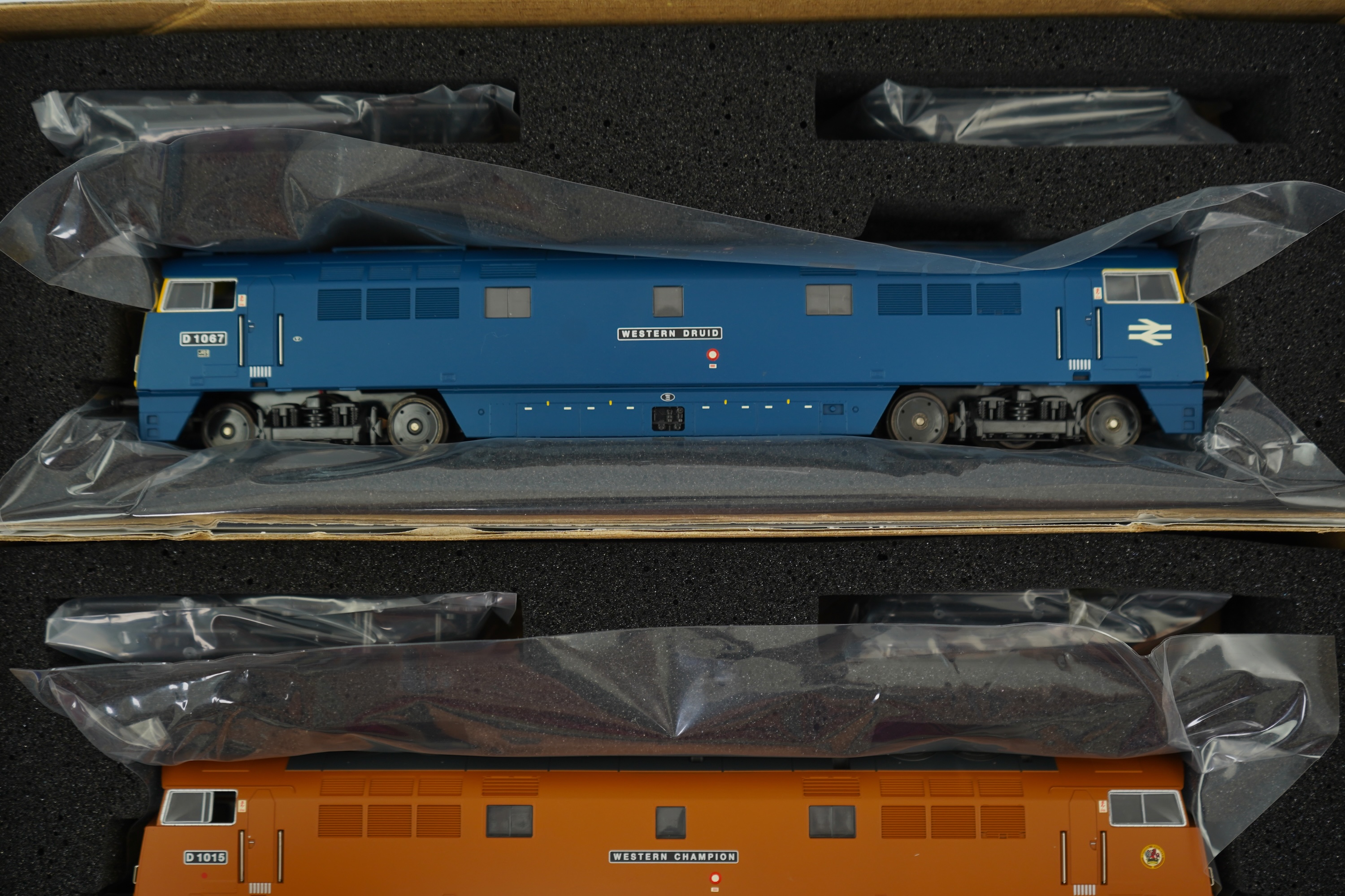 Two boxed Heljan 00 gauge railway BR Class 52 Co-Co diesel-hydraulic locomotives; Western Druid D1067 (5202) and Western Champion D1015 (5203)